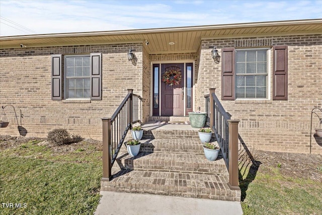 view of front facade featuring crawl space and brick siding