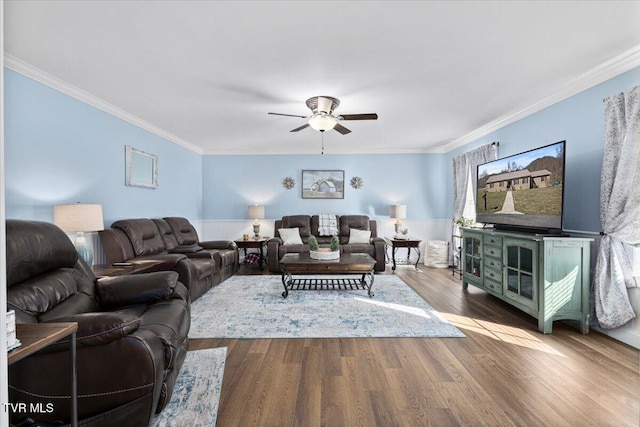 living room with ceiling fan, wood finished floors, and crown molding