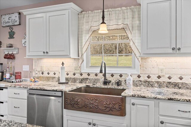 kitchen featuring a sink, white cabinetry, backsplash, and dishwasher