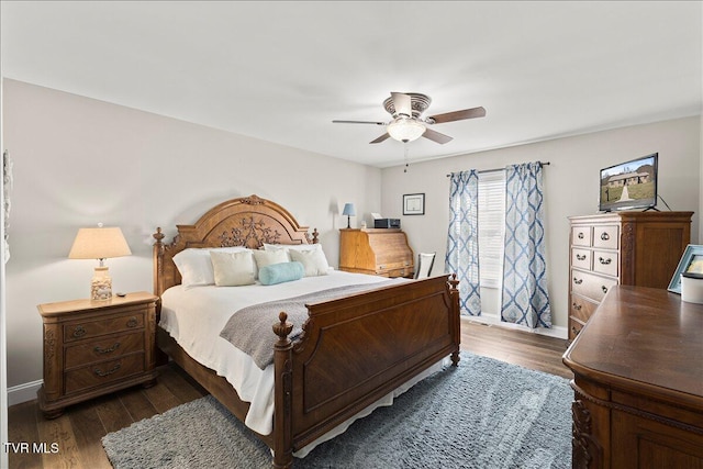 bedroom with dark wood finished floors, baseboards, and ceiling fan