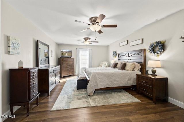 bedroom featuring dark wood-type flooring, baseboards, and a ceiling fan