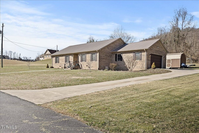 single story home with metal roof, an attached garage, brick siding, concrete driveway, and a front lawn