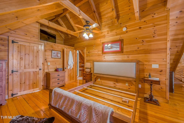 bedroom featuring lofted ceiling with beams, wood-type flooring, wood ceiling, and wooden walls