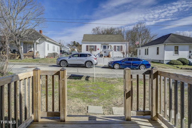 view of yard with a residential view and fence