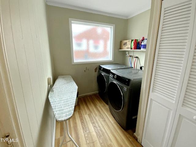 1536 Pineola Ave, Kingsport, TN 37664 - washroom featuring light wood-style flooring, independent washer and dryer, crown molding, baseboards, and laundry area