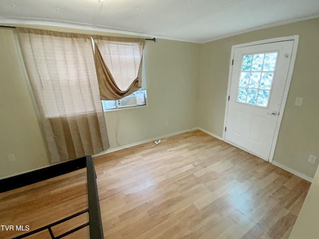 1536 Pineola Ave, Kingsport, TN 37664 - entrance foyer featuring cooling unit, baseboards, ornamental molding, and wood finished floors