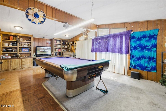 recreation room with built in shelves, vaulted ceiling, wood walls, and billiards