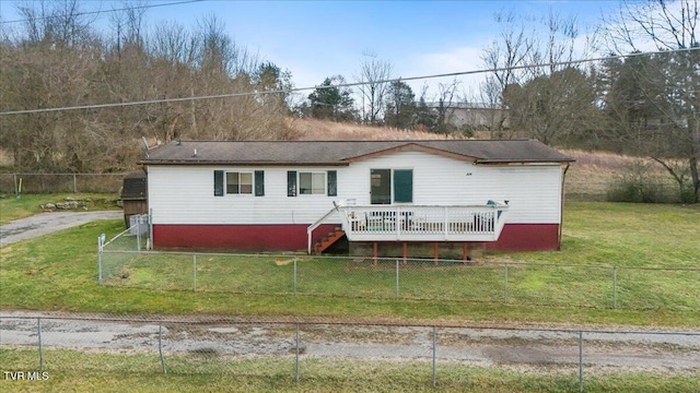 rear view of property featuring stairs, a yard, a fenced backyard, and a wooden deck