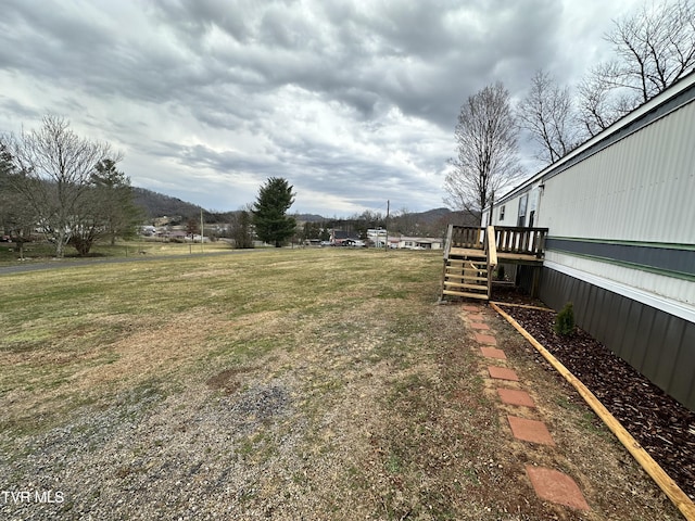 view of yard with a wooden deck