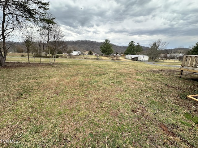 view of yard with a rural view