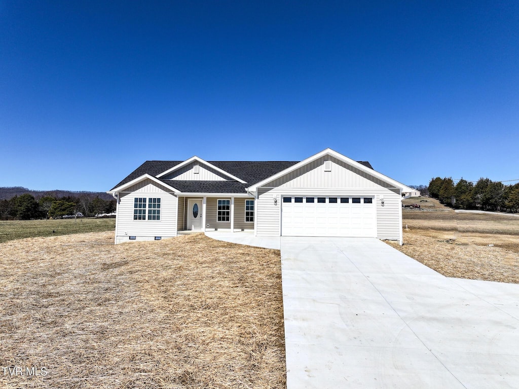 7185 Horton Hwy, Greeneville, TN 37745 - view of front facade featuring concrete driveway, board and batten siding, an attached garage, and roof with shingles