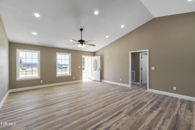 interior space with ceiling fan, high vaulted ceiling, recessed lighting, baseboards, and light wood-type flooring