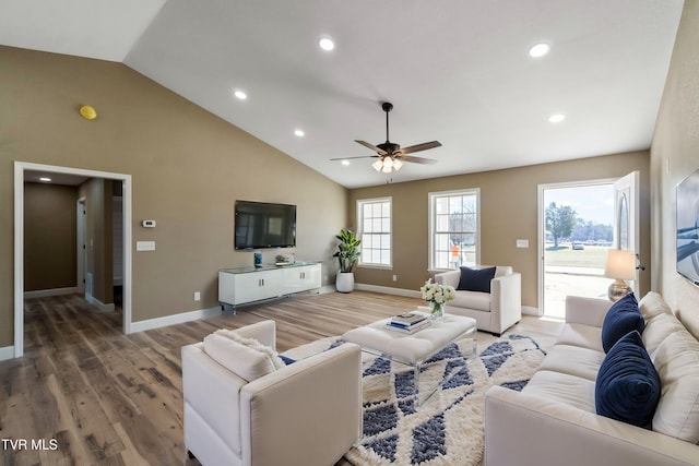 living area with baseboards and light wood-style floors