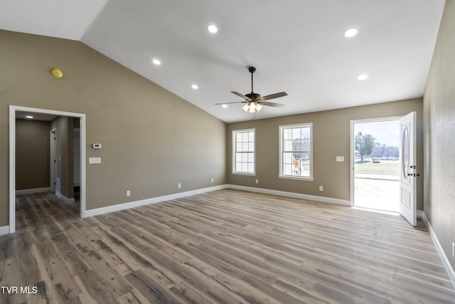 unfurnished living room featuring recessed lighting, ceiling fan, high vaulted ceiling, light wood-type flooring, and baseboards