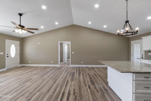 kitchen with open floor plan, light wood-type flooring, and white cabinets