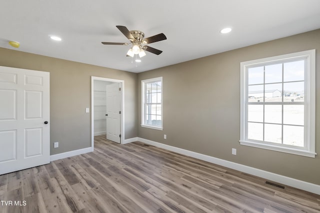 unfurnished bedroom with light wood finished floors, baseboards, visible vents, ceiling fan, and recessed lighting