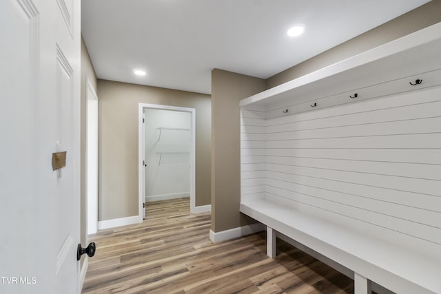 mudroom featuring recessed lighting, light wood-style flooring, and baseboards