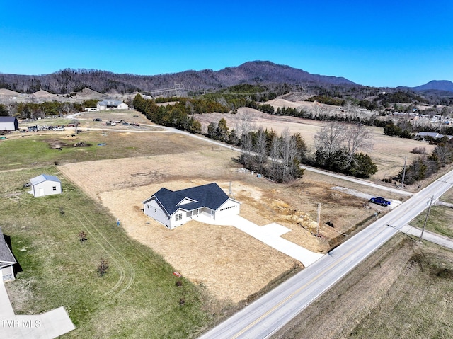 birds eye view of property featuring a mountain view