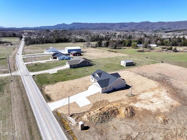 drone / aerial view with a rural view and a mountain view