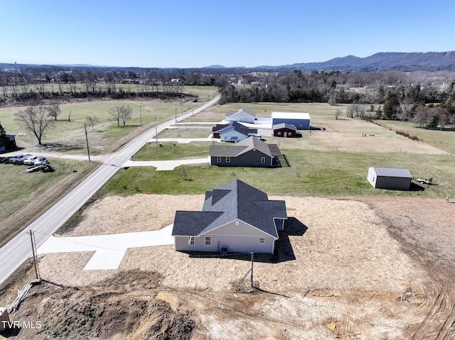 birds eye view of property featuring a rural view