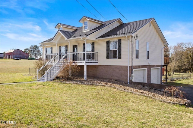 view of front facade featuring covered porch, a front lawn, stairway, and a garage