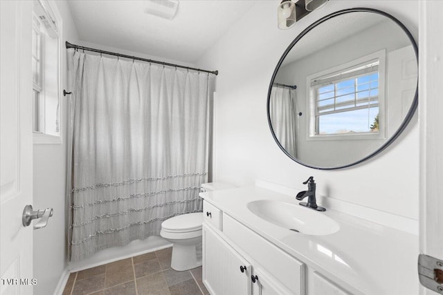 bathroom featuring toilet, curtained shower, visible vents, and vanity