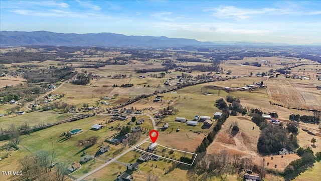 drone / aerial view with a rural view and a mountain view