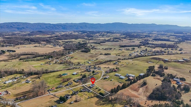 drone / aerial view featuring a mountain view