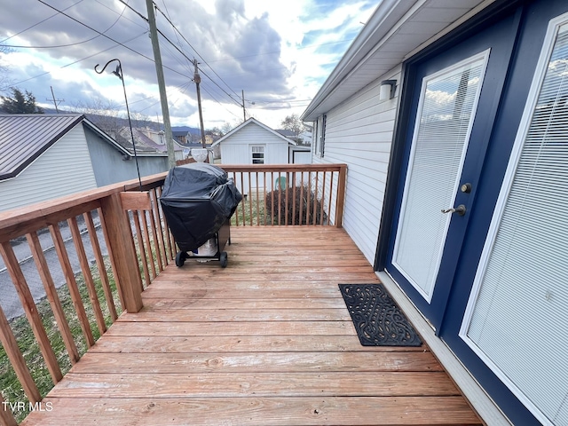 wooden deck featuring area for grilling