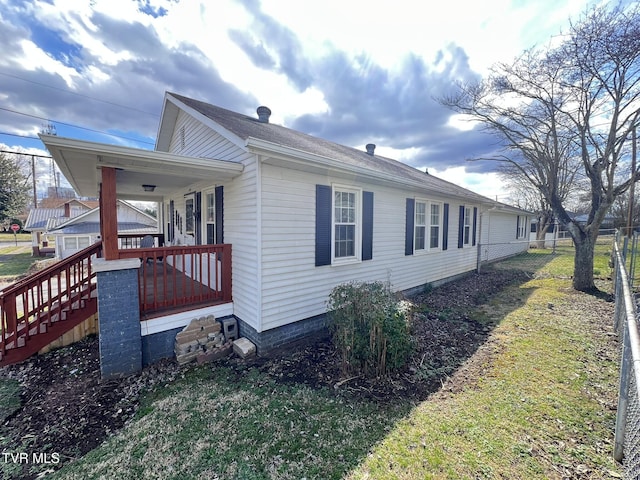 view of property exterior with covered porch