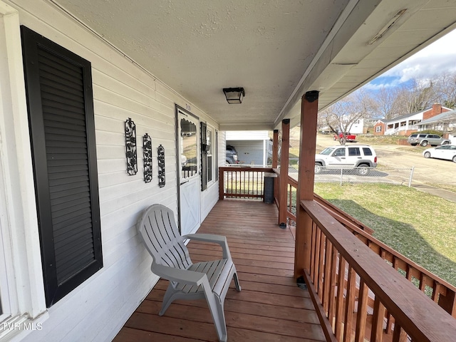 wooden deck featuring covered porch