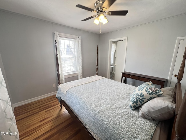 bedroom featuring wood finished floors, a ceiling fan, and baseboards