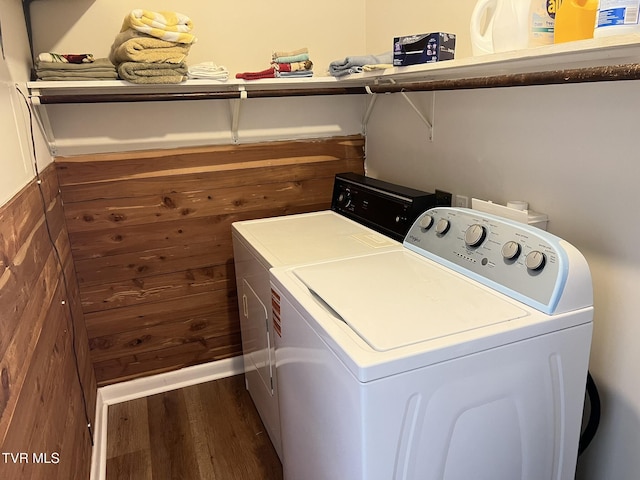 laundry room with dark wood-type flooring, laundry area, and independent washer and dryer