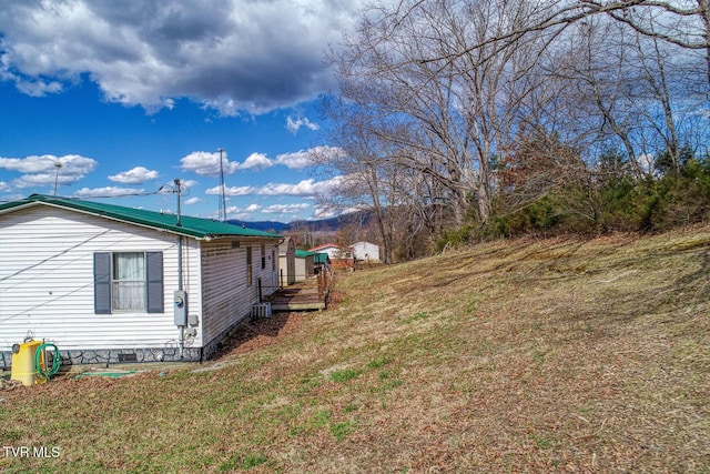 view of property exterior featuring crawl space and a yard