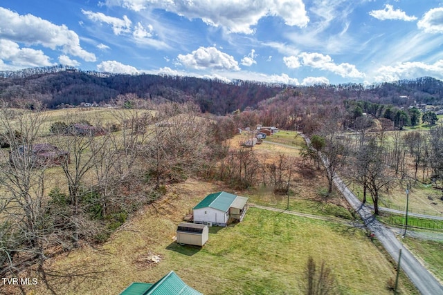 drone / aerial view with a rural view and a wooded view