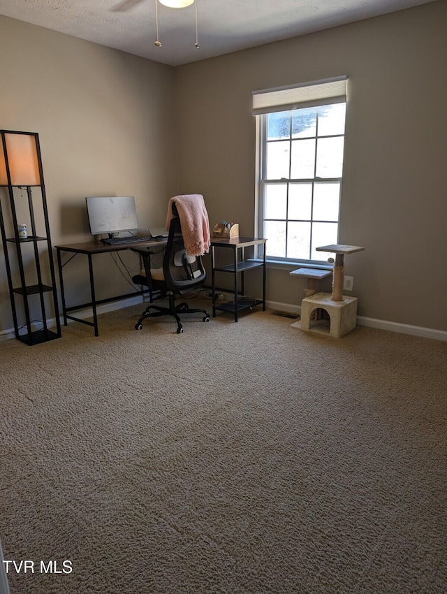 home office with ceiling fan, carpet, and baseboards