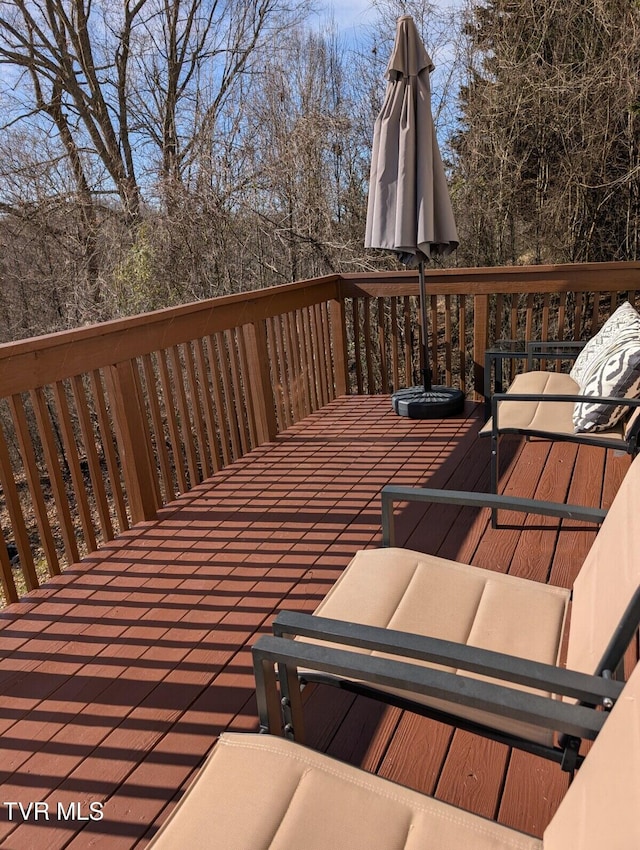 wooden deck featuring outdoor dining area