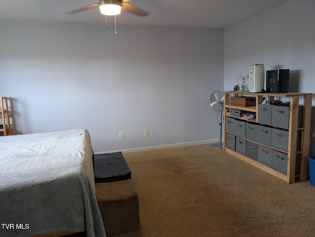 carpeted bedroom with a ceiling fan and baseboards