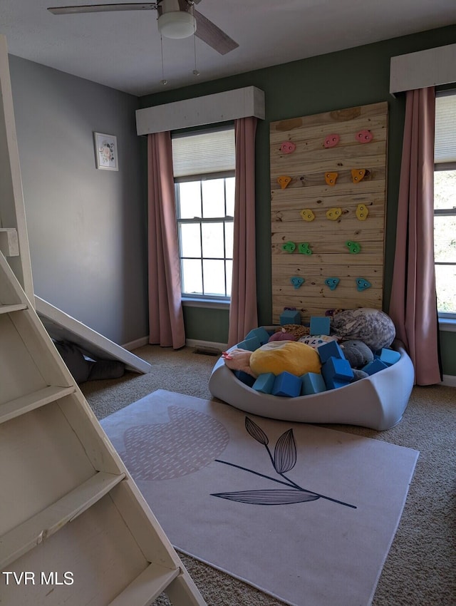 carpeted bedroom with a ceiling fan