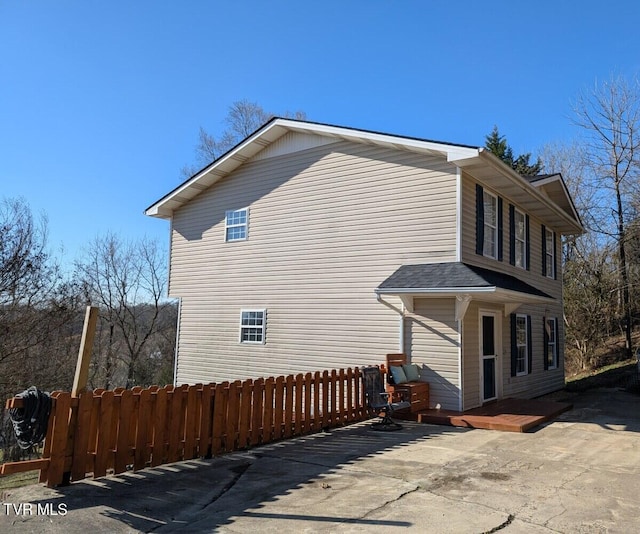 view of home's exterior featuring fence