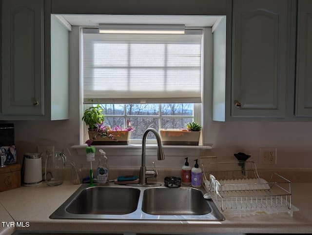 kitchen with light countertops and a sink