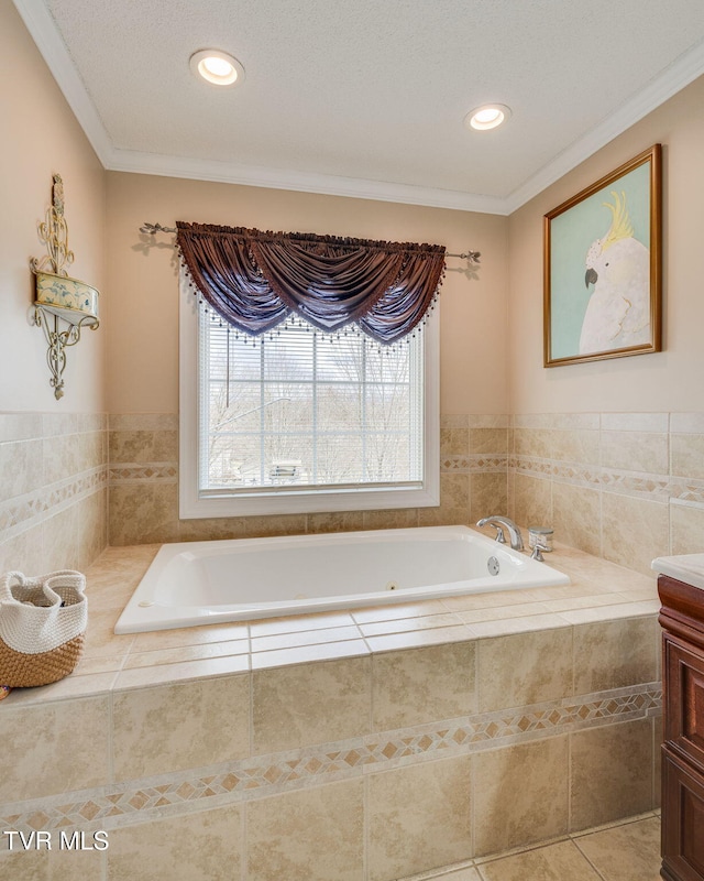 full bathroom with ornamental molding, vanity, a bath, and tile patterned floors