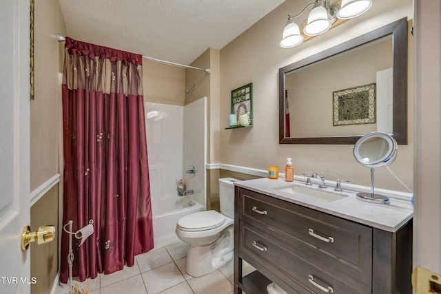 bathroom with a textured ceiling, toilet, shower / tub combo, vanity, and tile patterned floors