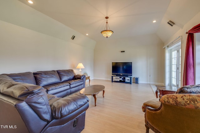 living area featuring light wood-type flooring, vaulted ceiling, baseboards, and recessed lighting