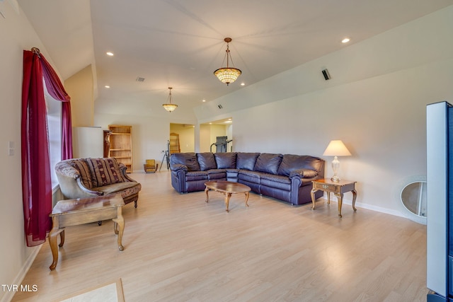 living room with light wood-style floors, baseboards, vaulted ceiling, and recessed lighting