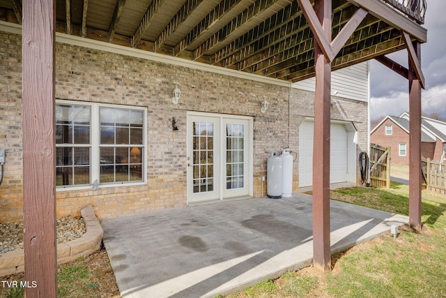 view of patio featuring fence and french doors