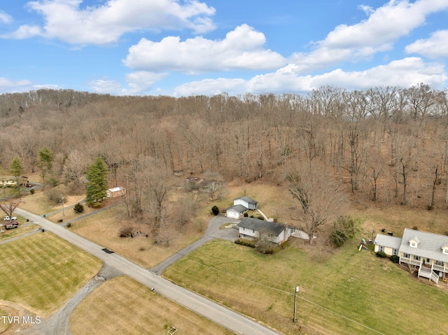 bird's eye view featuring a forest view and a rural view