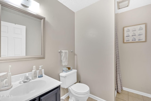 bathroom featuring vanity, a shower with shower curtain, baseboards, tile patterned floors, and toilet