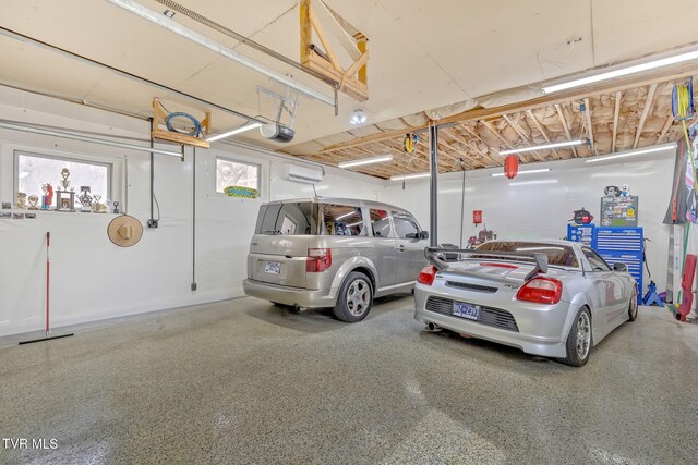 parking deck with a wall unit AC and a garage door opener