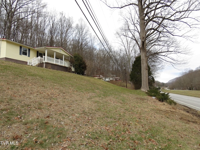 view of yard featuring a porch